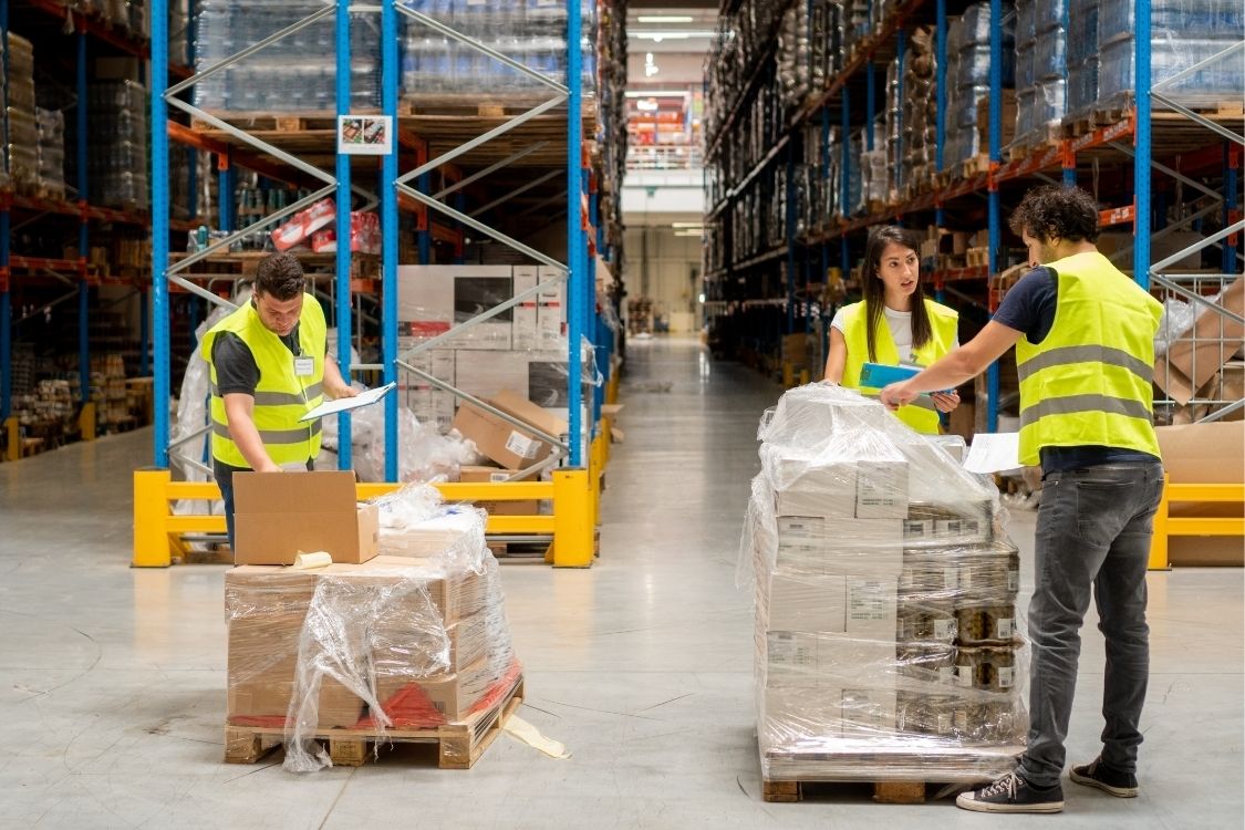 3pl logistics company - warehouse team helping with inspection, relabelling, repacking, kitting, returns handling